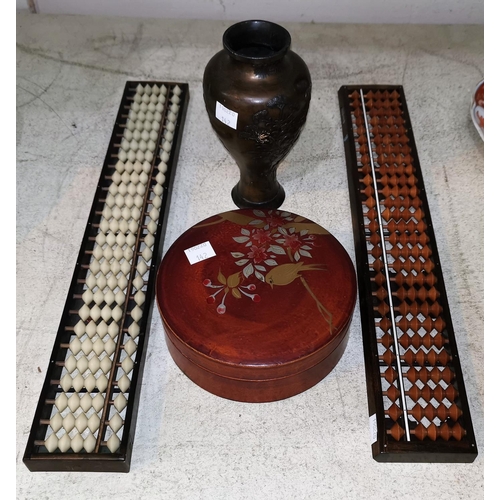 142 - A Japanese abacus or soroban; another; a metal vase; a circular lacquer box