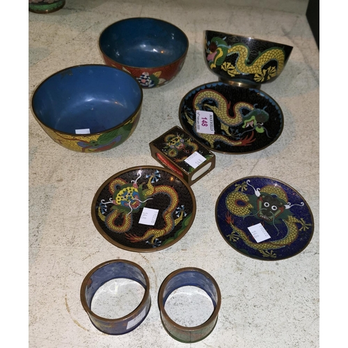 148 - Three Chinese cloisonné dishes; 2 bowls; 2 napkin rings; a matchbox cover, all decorated with dragon... 