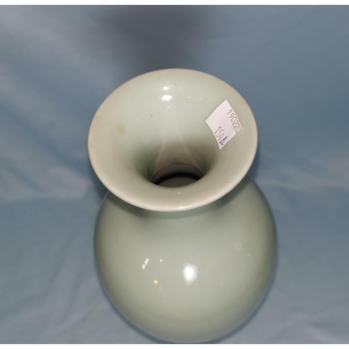 154A - A Chinese celadon balaster case with flared rim with mark to base 27cm on wooden stand