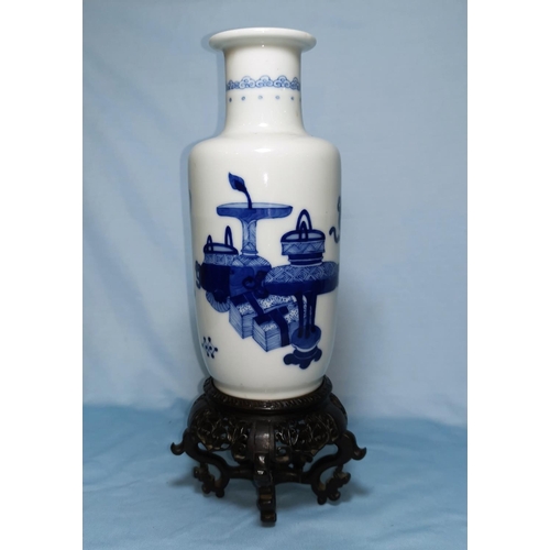 154B - A Chinese blue and white rouleau vase with mark to base height 22cm on hardwood stand