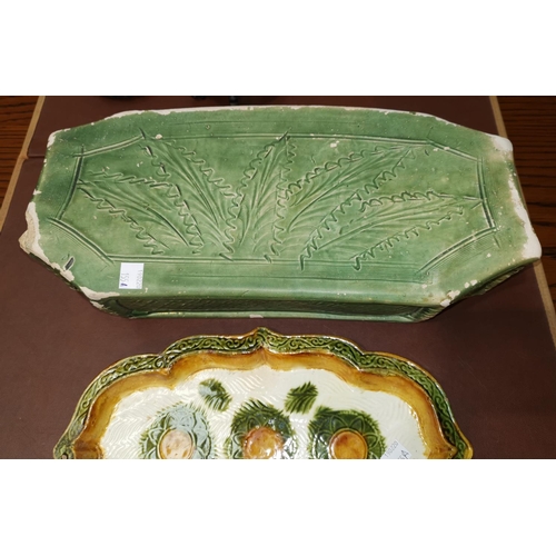 155A - An antique Chinese stone pillow in green and a similar stoneware Chinese dish