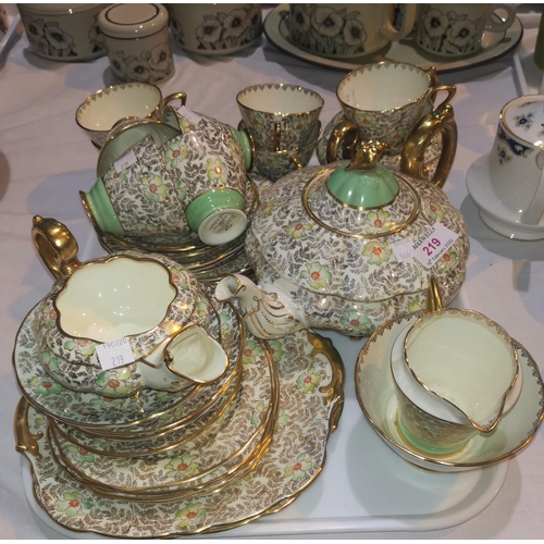219 - A 1930's R Stafford part tea service with green, gilt and floral decoration, 34 pieces approx. (seve... 