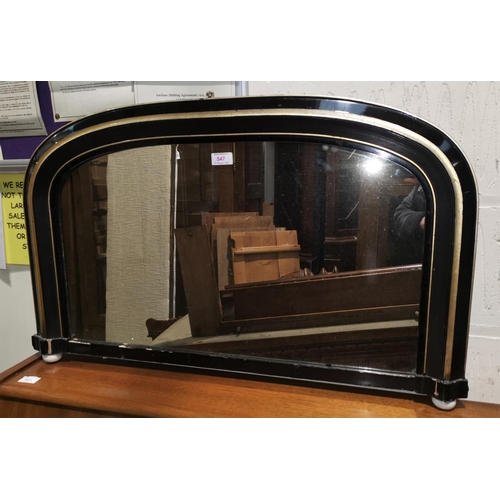 547A - An arch top overmantel mirror with ebonised and gilt border and a shield shped brass mirror