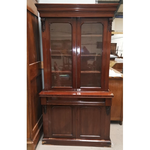 566 - A Victorian mahogany full height bookcase with 2 glazed doors over frieze drawer and 2 panelled door... 