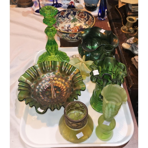 244 - An early 20th century green iridescent bowl with wavy rim; a selection of similar glass