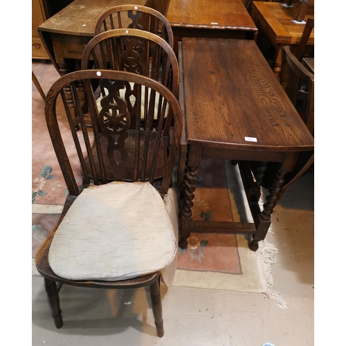 610 - A 1930's oak near matching dining suite comprising drop leaf table, sideboard and 3 wheel back chair... 