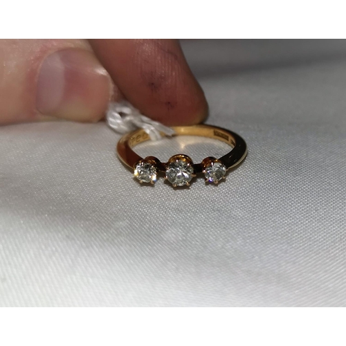 335 - An early 20th century 18 carat gold ring set 3 diamonds, central diamond 0.25 ct, weight 3.8 gm, siz... 