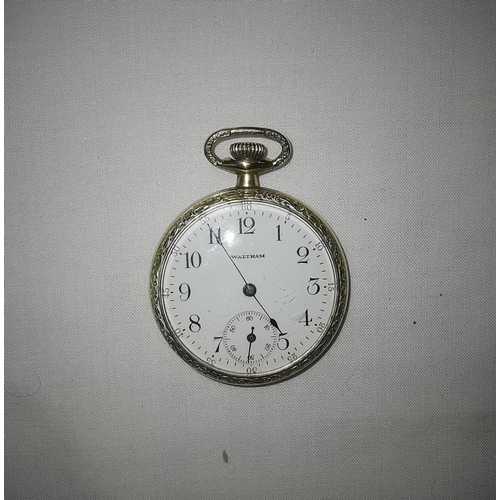 356 - A dress pocket watch by Waltham, open faced and keyless, in ornate gold plated case