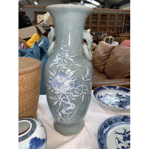 109B - A Chinese celadon crackle glaze vase with raised blue and white floral decoration, hand painted sign... 