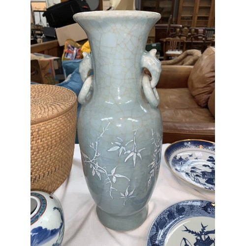 109B - A Chinese celadon crackle glaze vase with raised blue and white floral decoration, hand painted sign... 