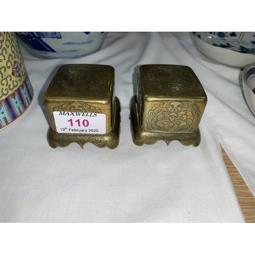 110 - A pair of Japanese Meiji period brass boxes decorated with flowers, birds etc, 7cm