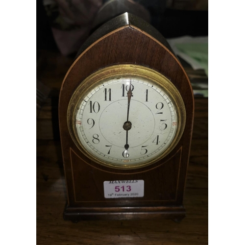 513 - A small white enamel dial mantel clock in inlaid mahogany case