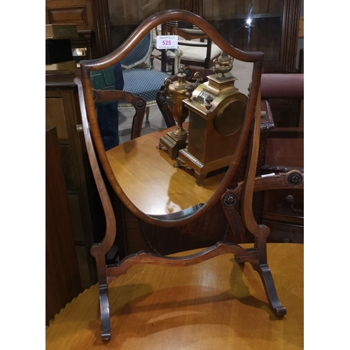 525 - An Edwardian shield shaped dressing table mirror in mahogany frame; a brass warming pan
