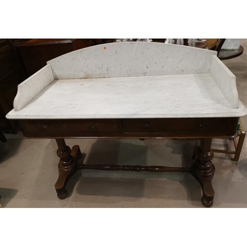 543 - A Victorian mahogany washstand with grey marble top and back