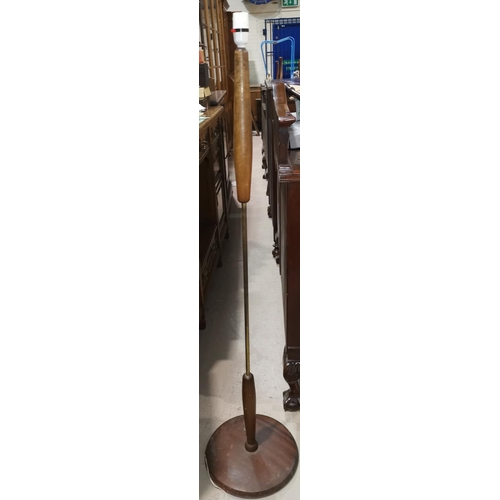 547 - A 1960's teak and brass upright standard lamp with circular base, height 132 cm
