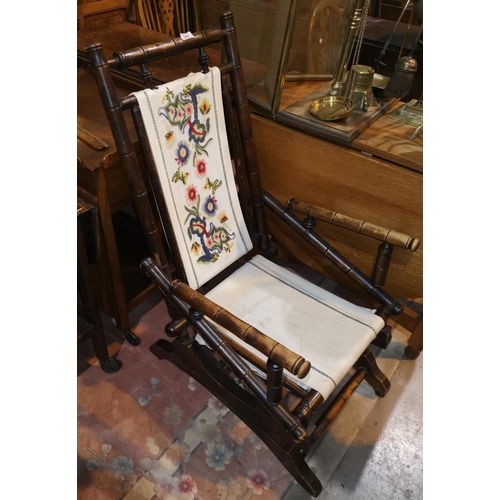 548 - An early 20th century turned wood American rocking chair