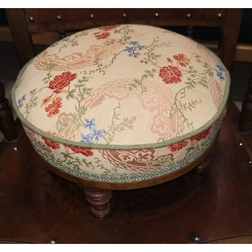 552 - A Victorian pair of circular footstools reupholstered in floral fabric; a pair of church candlestick... 