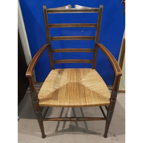 553 - A ladder back chair with rush seat; a pine 3 height chest of drawers