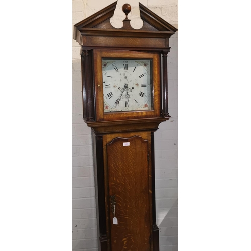 555 - An early 19th century oak longcase clock, the later case with mahogany crossbanding, the hood with b... 
