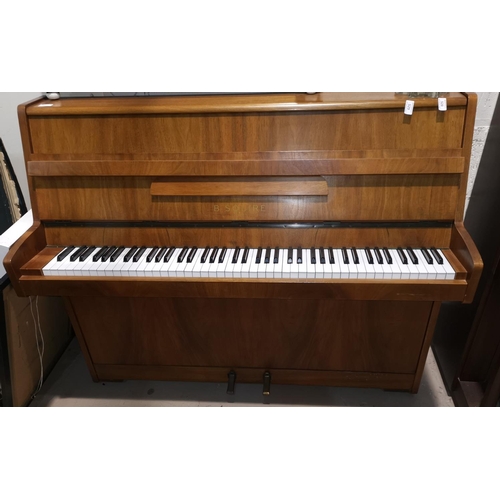 601 - A modern overstrung upright piano in walnut case, by B Squire, with stool