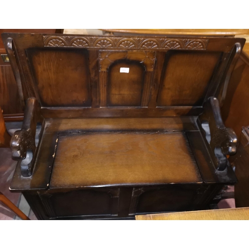605 - An oak reproduction monks bench with box seat