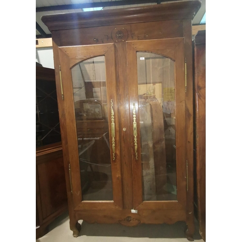 642 - A French Provincial oak full height side cabinet with 2 glazed doors, on shaped feet, height 230 cm ... 