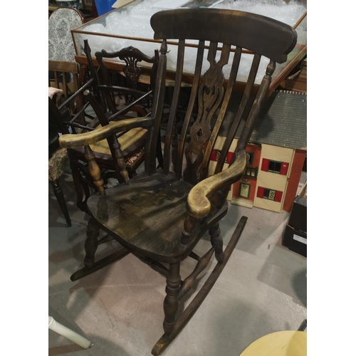 660 - A large country style rocking arm chair with turned supports