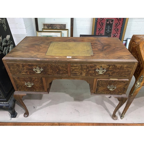648 - A 1930's Queen Anne style walnut desk with 4 drawers, on cabriole legs