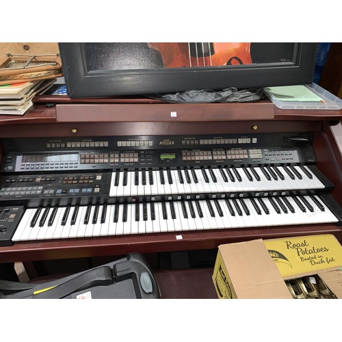610a - An AT 90 twin manual electric organ by Roland Atelier, with stool