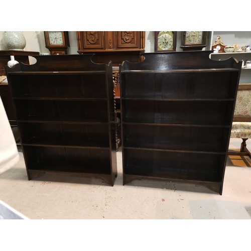 573 - A pair of early 20th century oak 5 height bookcases