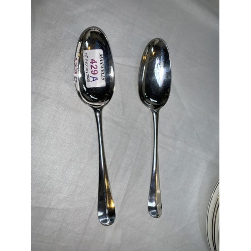 429a - A Georgian pair of silver serving spoons by John Wakelin, marks worn, c. 1780