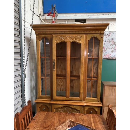 602 - A colonial style full height display cabinet with glazed upper section, drawer and cupboard below