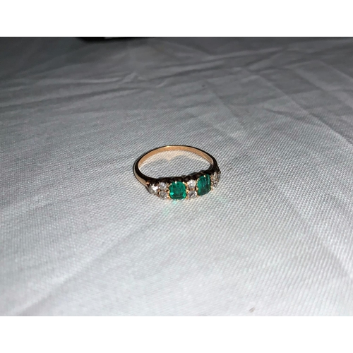 336 - A late Victorian ring set 2 cushion cut emeralds flanked/interspersed with old cut diamonds, weight ... 