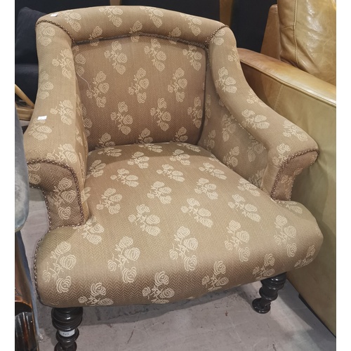595A - An Edwadian arm chair upholstered in gold material with turned ebonised legs