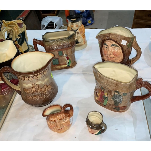 32 - A selection of Royal Doulton including 4 character jugs, 2 Dickens jugs & a plate; a QEII Coronation... 