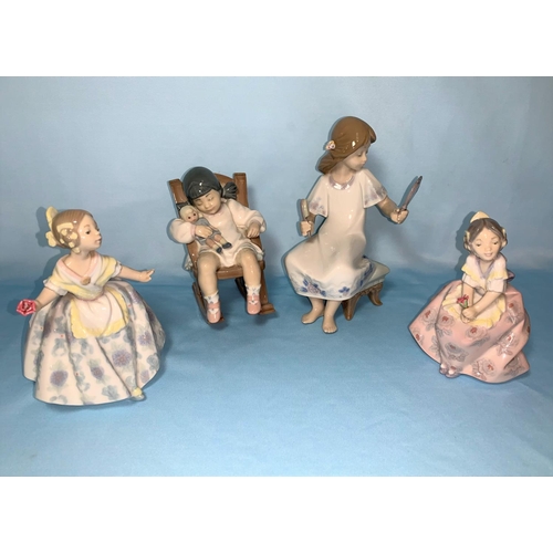 7 - 4 Lladro figures of girls, 2 seated & 2 holding flowers 10 - 19cm