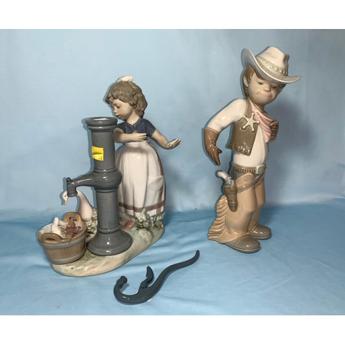 83 - A Lladro figure - Boy in Cowboy outfit; a Lladro group - Girl by an old pump (handle detached)