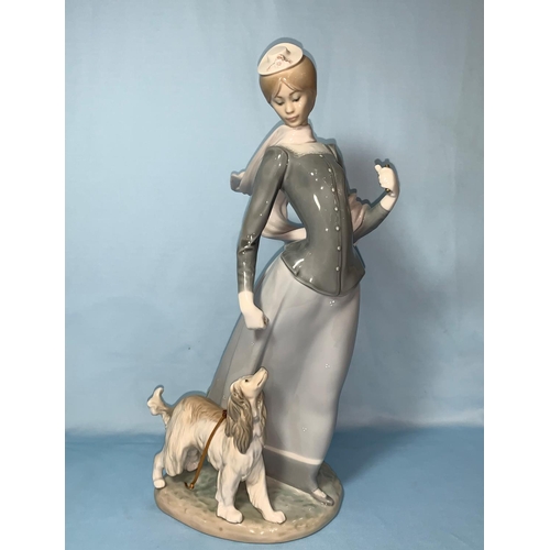 88 - A large Lladro group woman & dog Height 40cm with stand (no parasol)