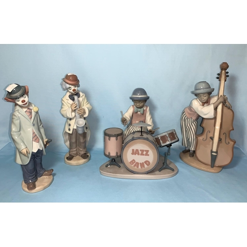 135 - Four Lladro figures forming a jazz band comprising drummer, double bass player, violin player and sa... 