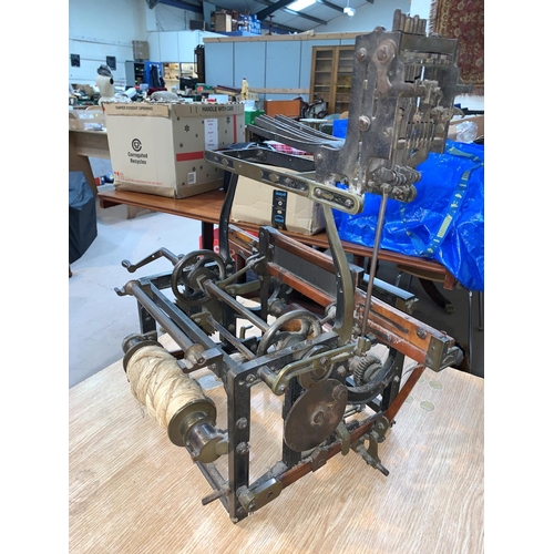 756 - A small scale hand powered Jacquard silk weaving loom of iron and wood construction, probably 19th c... 