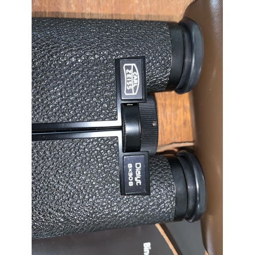 765 - A pair of Carl Zeiss Dialyt 8 x 30B field glasses, ER case and a pair of Boots binoculars