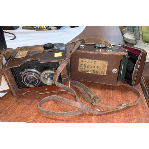 751 - a YASHICA-MAT TLR camera in leather case with accessories and another similar camera