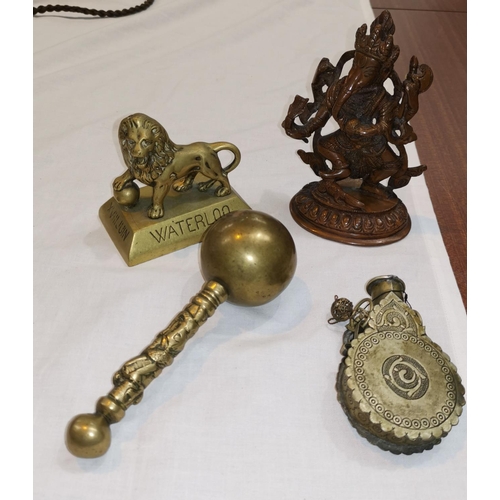 225 - A middle eastern metal flask, a copper/brass figure of Ganesh, a Waterloo lion and another item