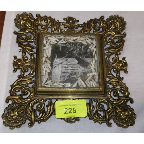 228 - An early 20th century brass teapot stand with commemorative photograph of HMS TITANIC surrounded by ... 