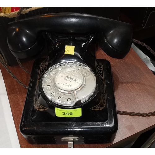 246 - A vintage Japanned metal wall mounting Bells Rotary telephone