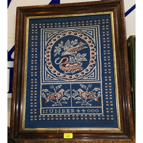 248 - An early/mid 20th century bead work parcel in blue, red and white depicting birds in rosewood effect... 