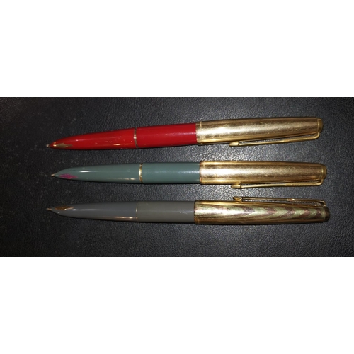 287 - Three Parker 61 fountain pens with gilt lids