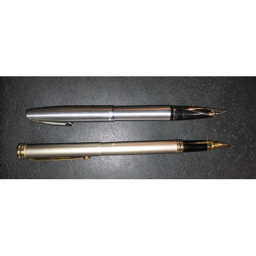 290 - A Sheaffer brushed stainless steel cased fountain pen, another similar German fountain pen