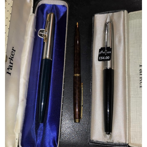 294 - Two modern Parker fountain pens with brushed steel lids and a Parker ballpoint