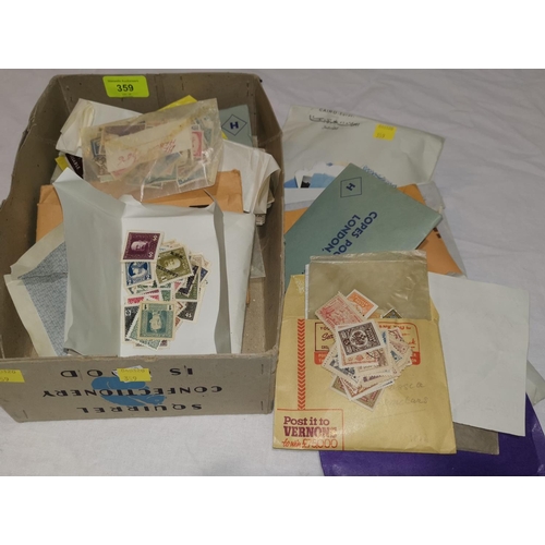 359 - A quantity of unsorted stamps in packets